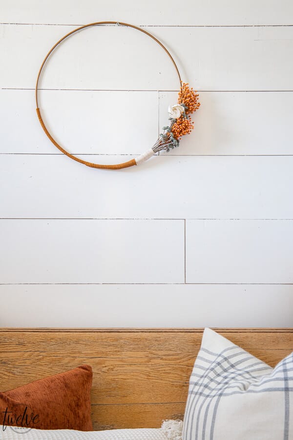 Gorgeous boho style hoop wreath for spring! This has beautiful dried flowers, twine and leather accents and will work in your home for more than just the spring season.
