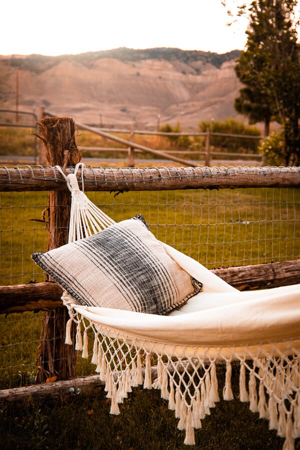 Gorgeous views with a macrame hammock and Bryce Canyon in the background.