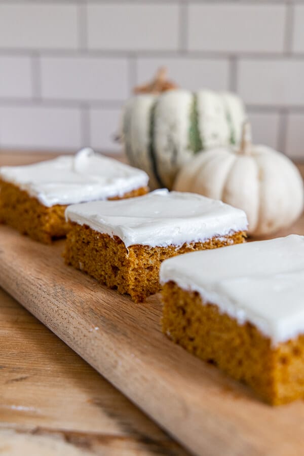 How to make these easy pumpkin bars with cream cheese frosting in under 1 hour! It tastes amazing, it perfect for a big crowd and is the perfect treat for fall.