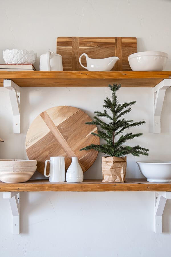 How to make your store bought tabletop trees look perfect in your home with this easy decor hack! Gorgeous Christmas tree ideas.
