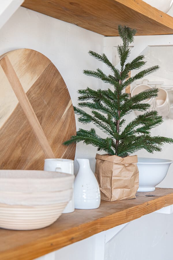 How to make your store bought tabletop trees look perfect in your home with this easy decor hack! Gorgeous Christmas tree ideas.
