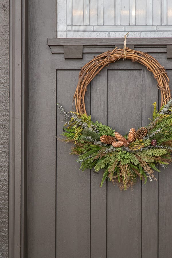 How to make a gorgeous winter door wreath perfect to use all season, well into the spring. This is a full tutorial with video on how to make one!