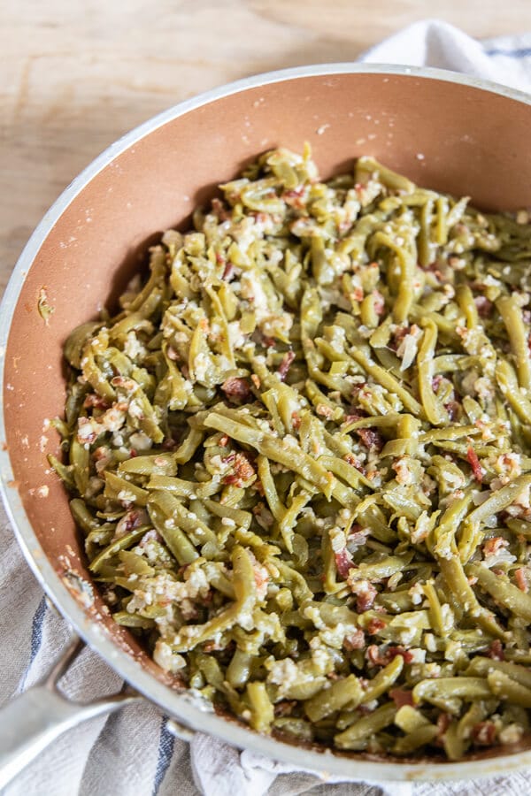 These spicy sauteed green beans with bacon and parmesan is the perfect side dish on busy weeknights or for a holiday party! 
