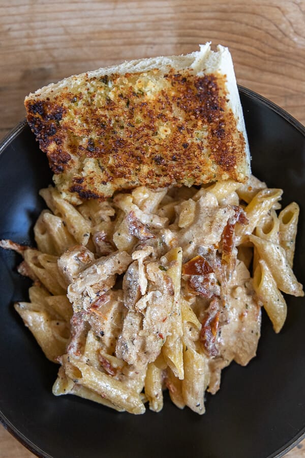 Creamy Tuscan sun dried tomato and chicken pasta recipe.  This pasta recipe is so easy to make and tastes amazing! It is a perfect weeknight meal!