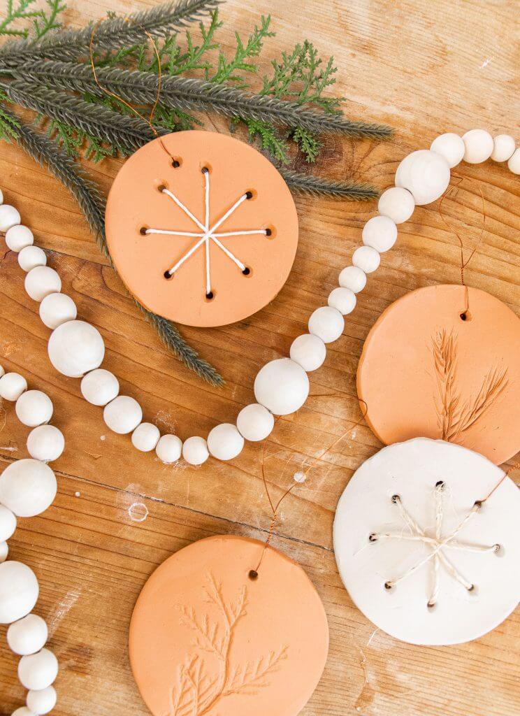 Make these simple air dry clay ornaments with simple step by step instructions.  These are easy to make and a fun add to your tree!
