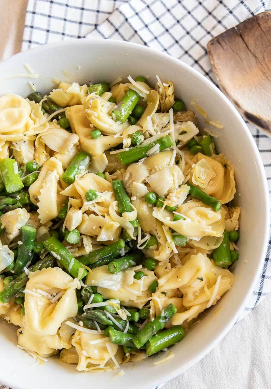 Cheese Tortellini Pasta Salad With Asparagus, Peas, Artichokes, and Parmesan Cheese
