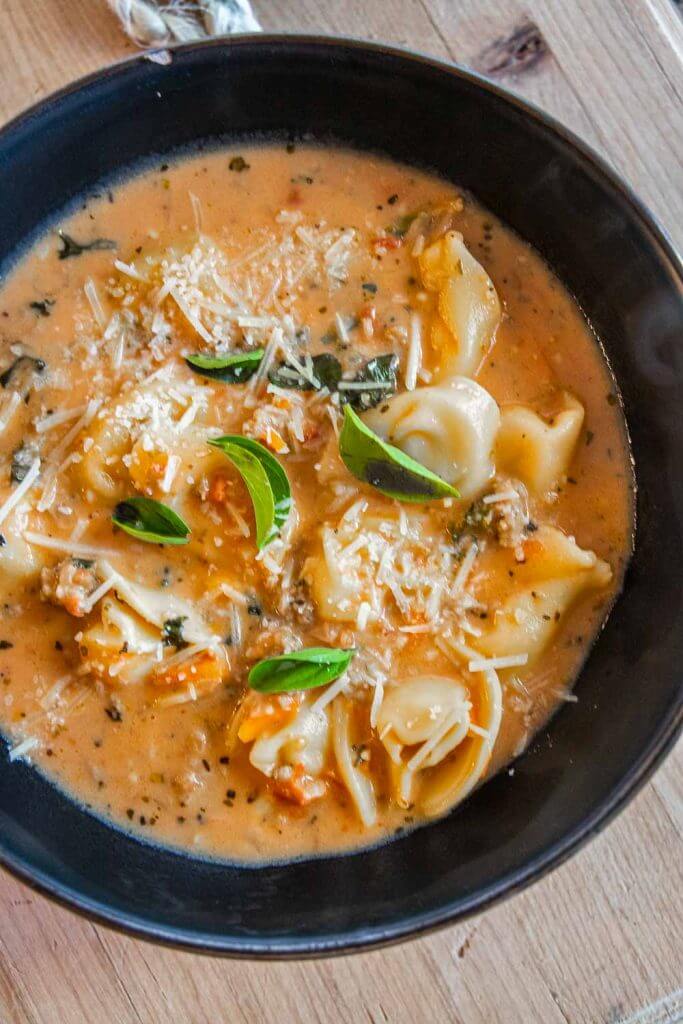 Make this amazing one pot creamy spicy sausage and tortellini soup in 30 minutes. It is easy to make and so very flavorful.
