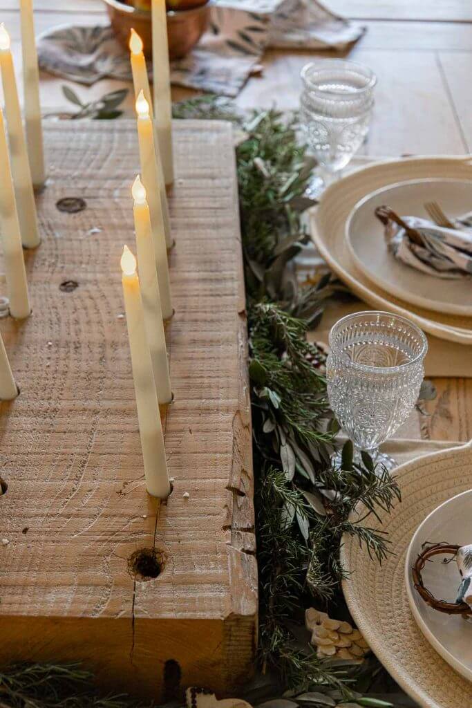This handmade style holiday tablescape keeps things simple, cozy and inviting by layering textures, adding simple decor items and more.