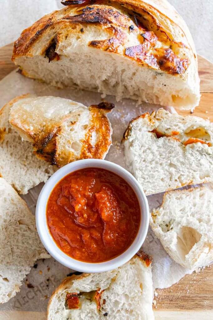 Make this amazing sourdough pizza bread with all the amazing toppings mixed right into the bread! Dip it in marinara sauce for a fun dinner!