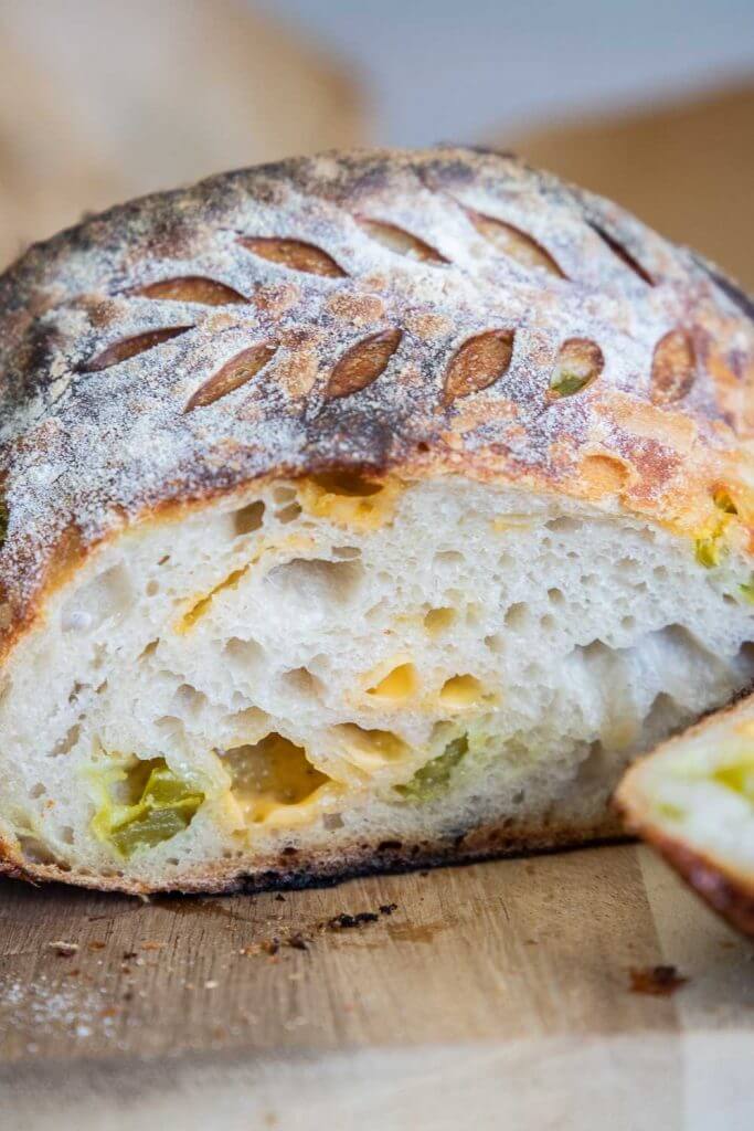 Make this amazing cheddar jalapeno sourdough bread! This requires little work on your part.  Its flavor is amazing! The soft pillowy crumb of this sourdough bread is perfect! The flavor of the jalapenos and cheddar make this the perfect option as toast or even use it like you would a bagel! We love this bread as toast and with its crusty outside contrasting the soft inside and its chewy texture, you will want to make an entire meal of it!