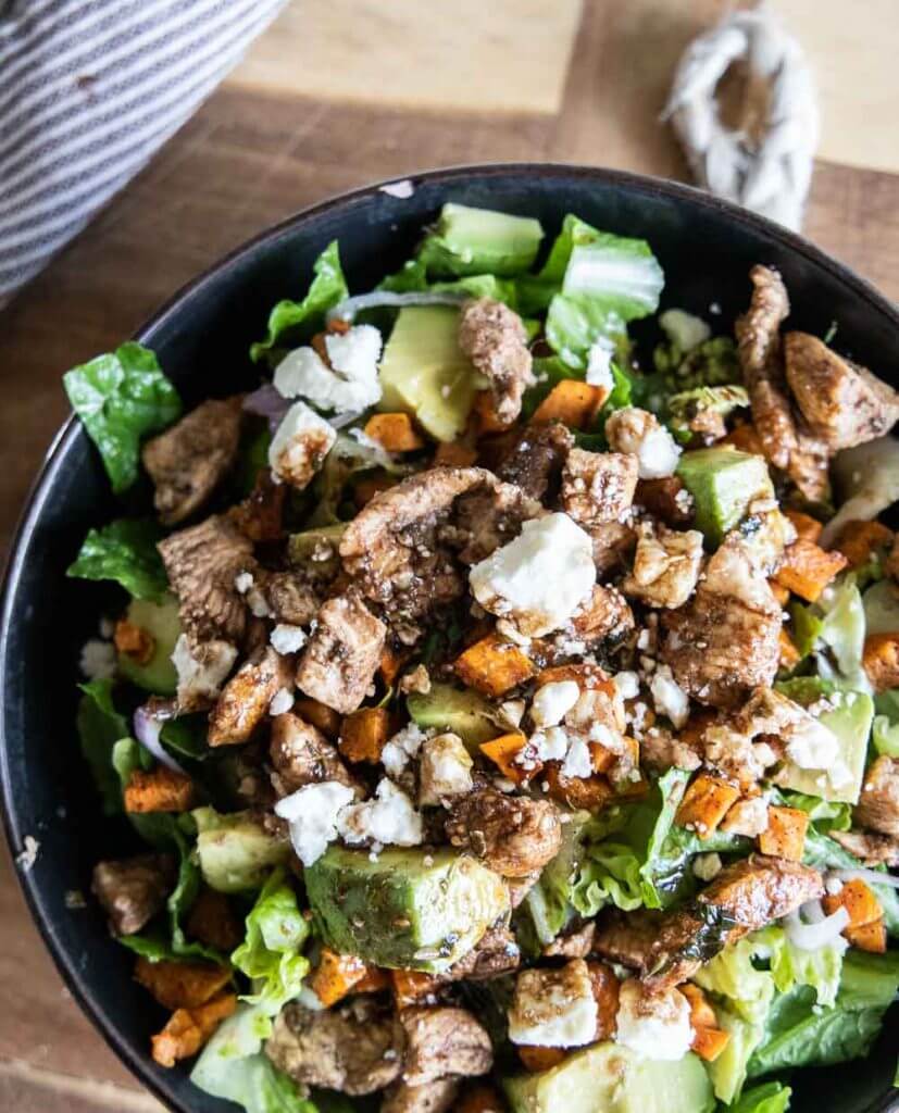 This balsamic chicken salad is packed with protein and amazing flavors with sweet potatoes, avocado, feta cheese and shallots.