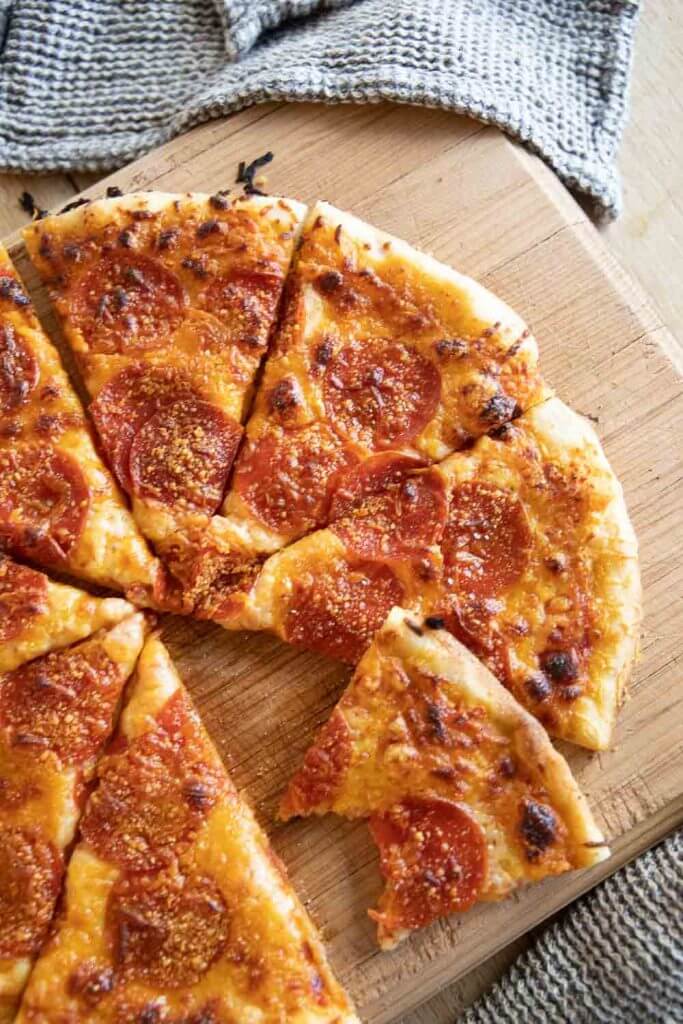 This easy sourdough pizza dough it perfection! Its easy to make and creates the most crispy and flavorful sourdough pizza crust!