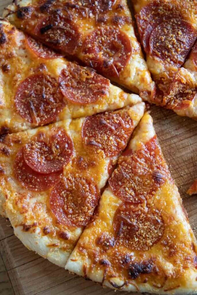 This easy sourdough pizza dough it perfection! Its easy to make and creates the most crispy and flavorful sourdough pizza crust!