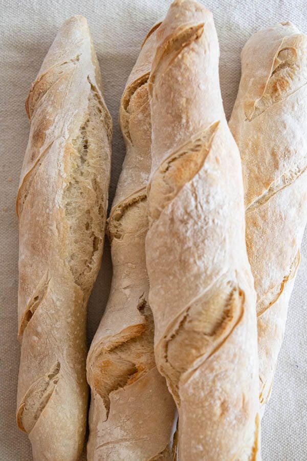 This is a great recipe for sourdough baguettes. These are great for snacking on with cheese or fresh meats, toasted and used for soups and pasta dishes. You can also use them to make rustic sandwiches. Its a great all around sourdough baguette recipe!